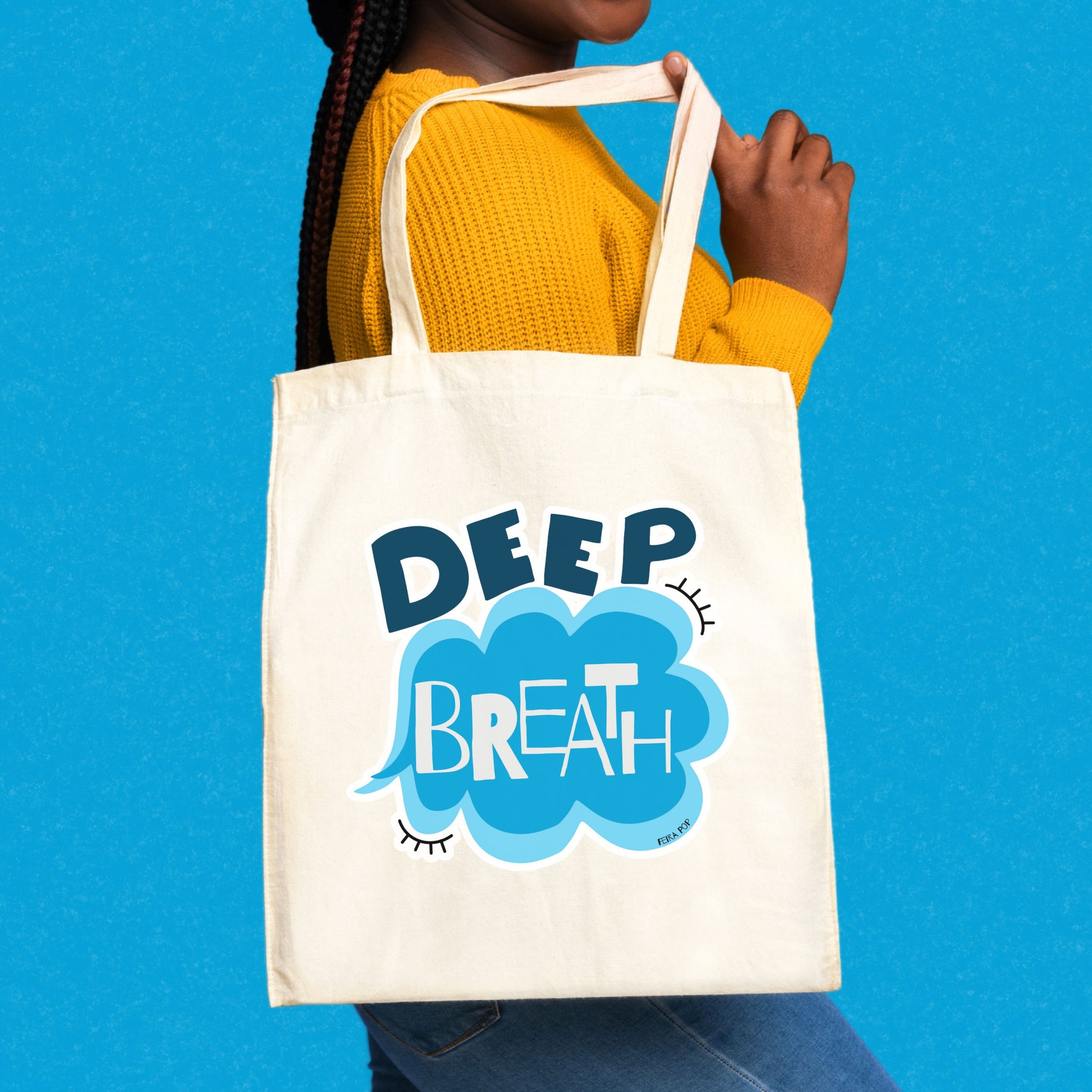 Deep Breath Tote Bag with original drawing of a serene cloud and the words Deep Breath written across it, perfect for carrying daily essentials and adding a touch of whimsy to your outfit.