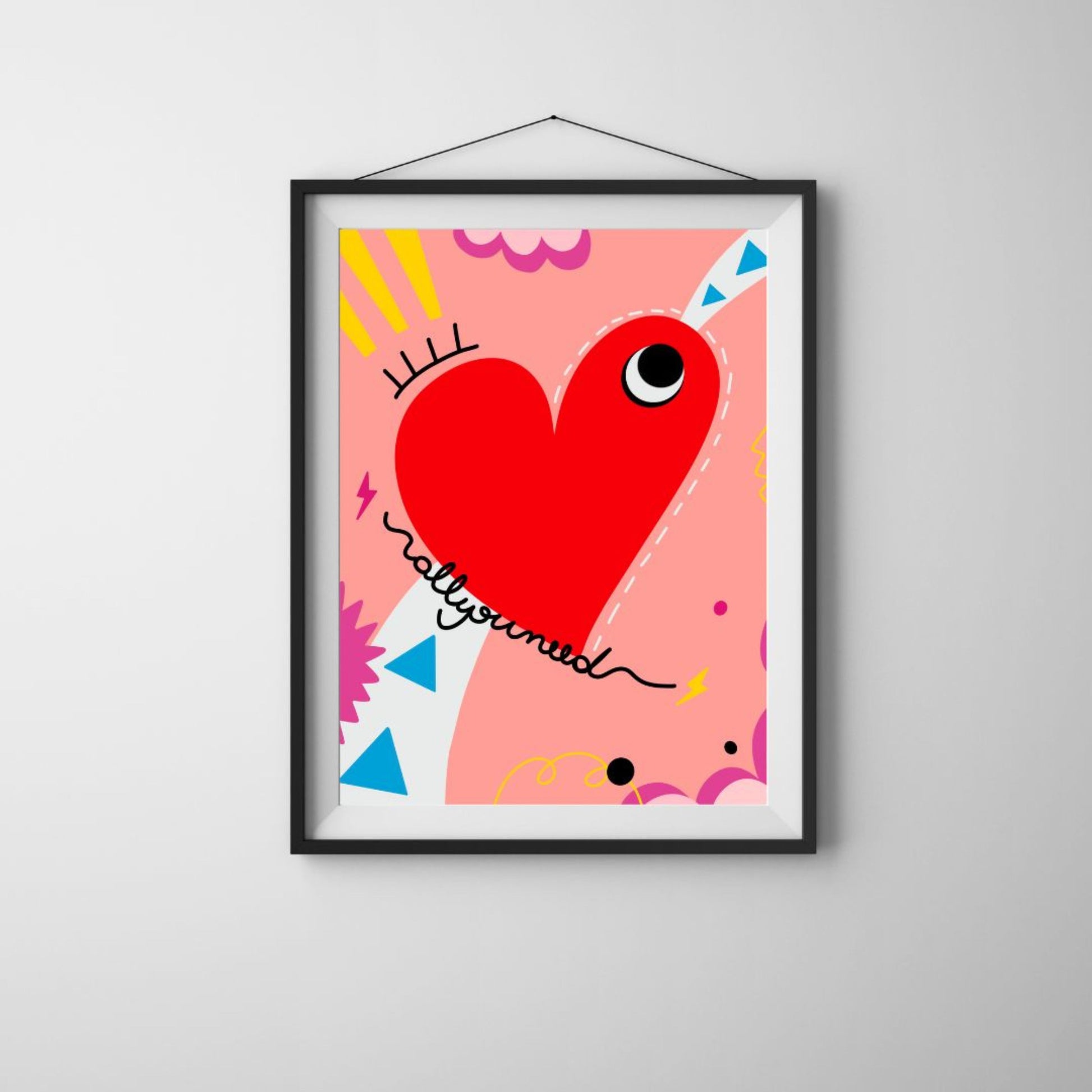 All You Need art print with an original drawing of a quirky red heart with one big eye, colorful background, adding a touch of whimsy and joy to any space.