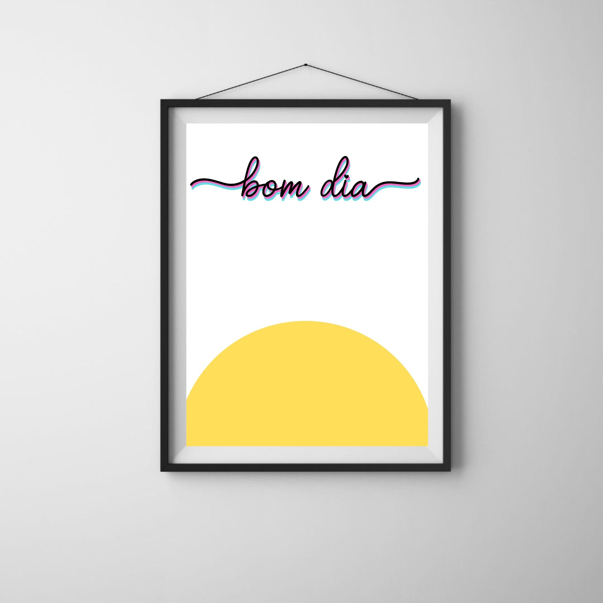 Bom Dia Art Print featuring a vibrant yellow sun and the spirited phrase Bom Dia, perfect for brightening any space with a cheerful morning greeting. Bom Dia means Good Morning in Portuguese.