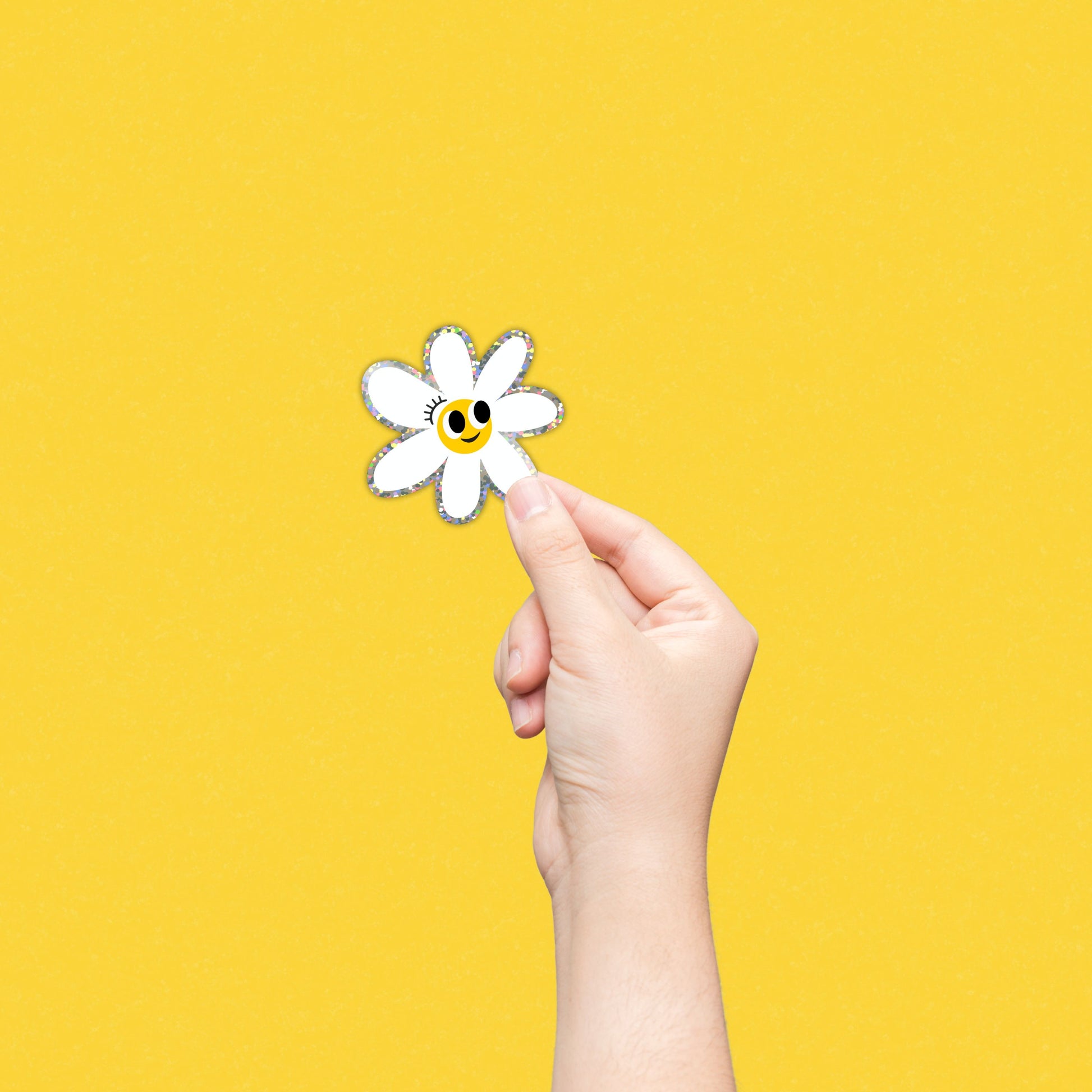 Glitter white daisy sticker with a smiley face, perfect for adding a touch of whimsy and positivity to your belongings.