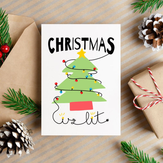 Christmas greeting card with the phrase Christmas is Lit featuring a drawing of a Christmas tree with colorful lights. Perfect for spreading festive cheer during the holiday season.