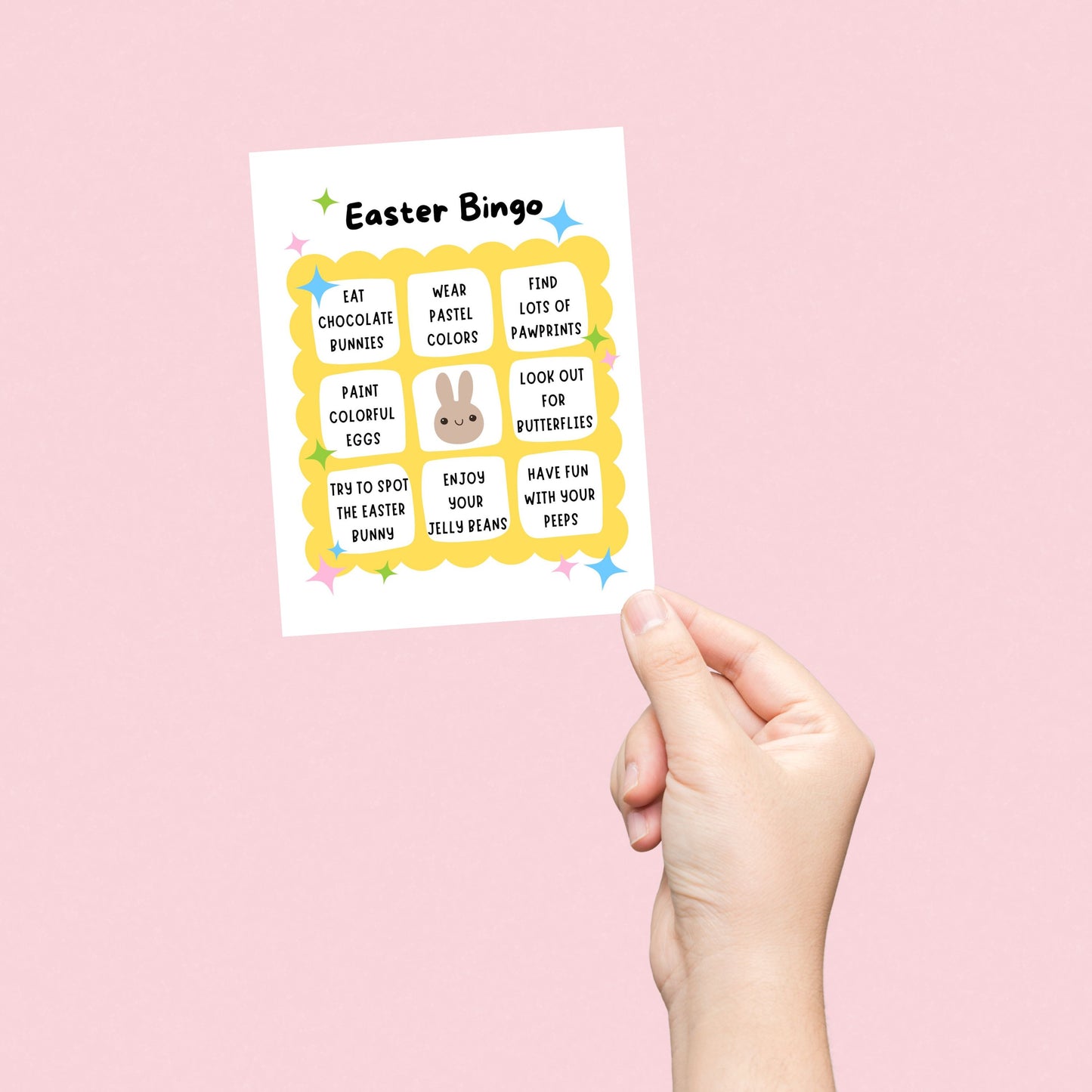 Easter Bingo greeting card featuring a playful bingo card with festive activities like eating chocolate bunnies, painting colorful eggs, and wearing pastel colors. Fun and lighthearted Easter card for friends, family, and loved ones.