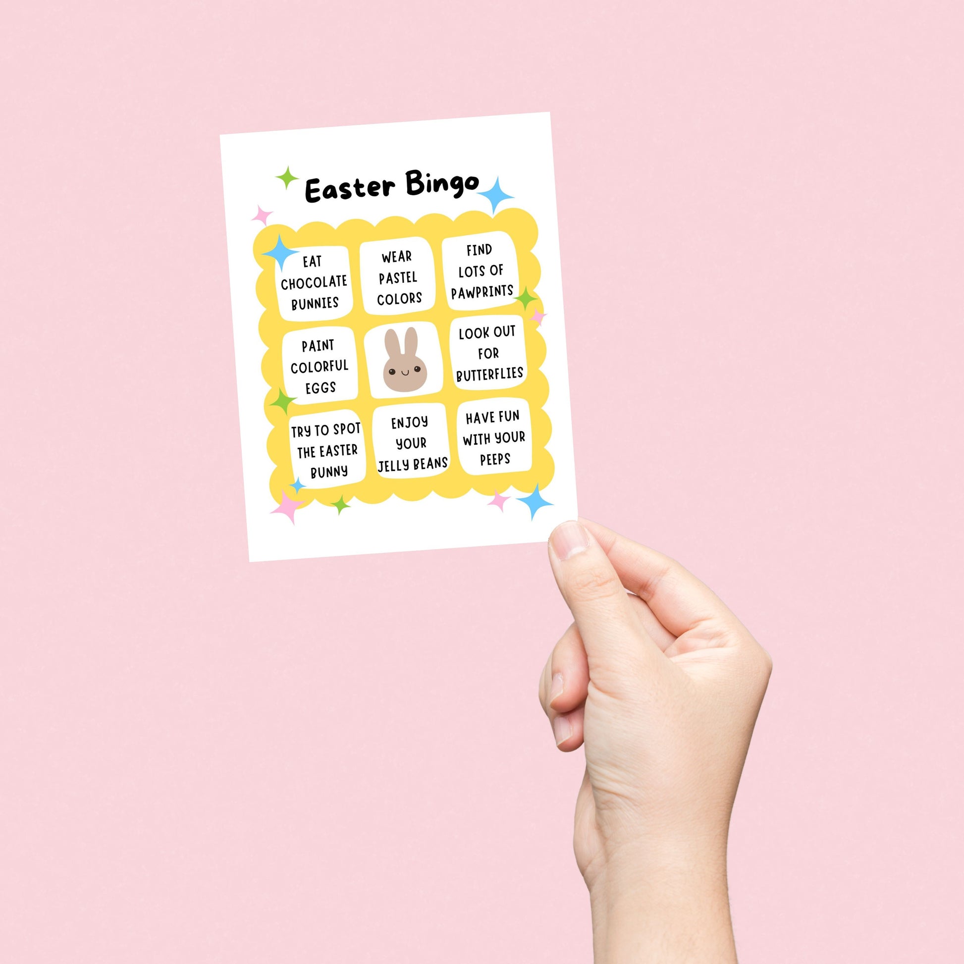Easter Bingo greeting card featuring a playful bingo card with festive activities like eating chocolate bunnies, painting colorful eggs, and wearing pastel colors. Fun and lighthearted Easter card for friends, family, and loved ones.