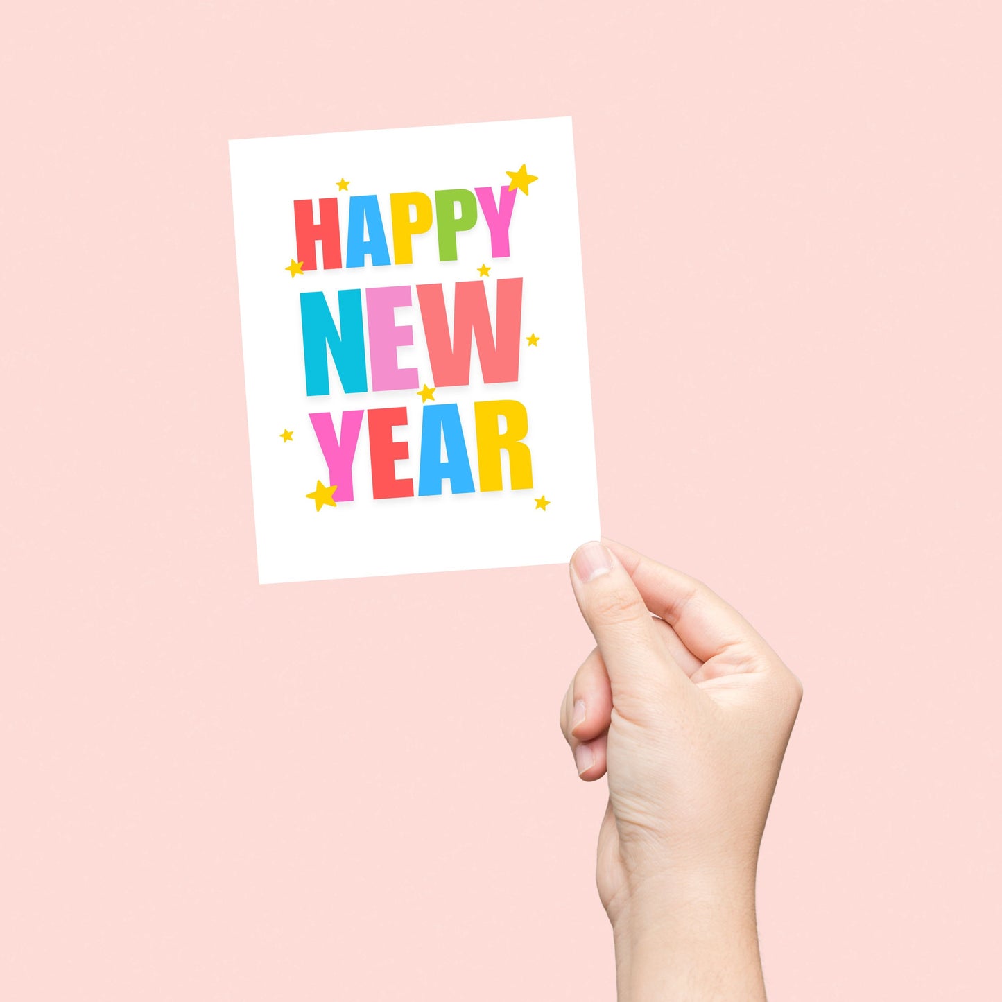 Colorful Happy New Year greeting card featuring bold rainbow letters spelling "Happy New Year," surrounded by festive stars on a white background. Perfect for spreading New Year's cheer.