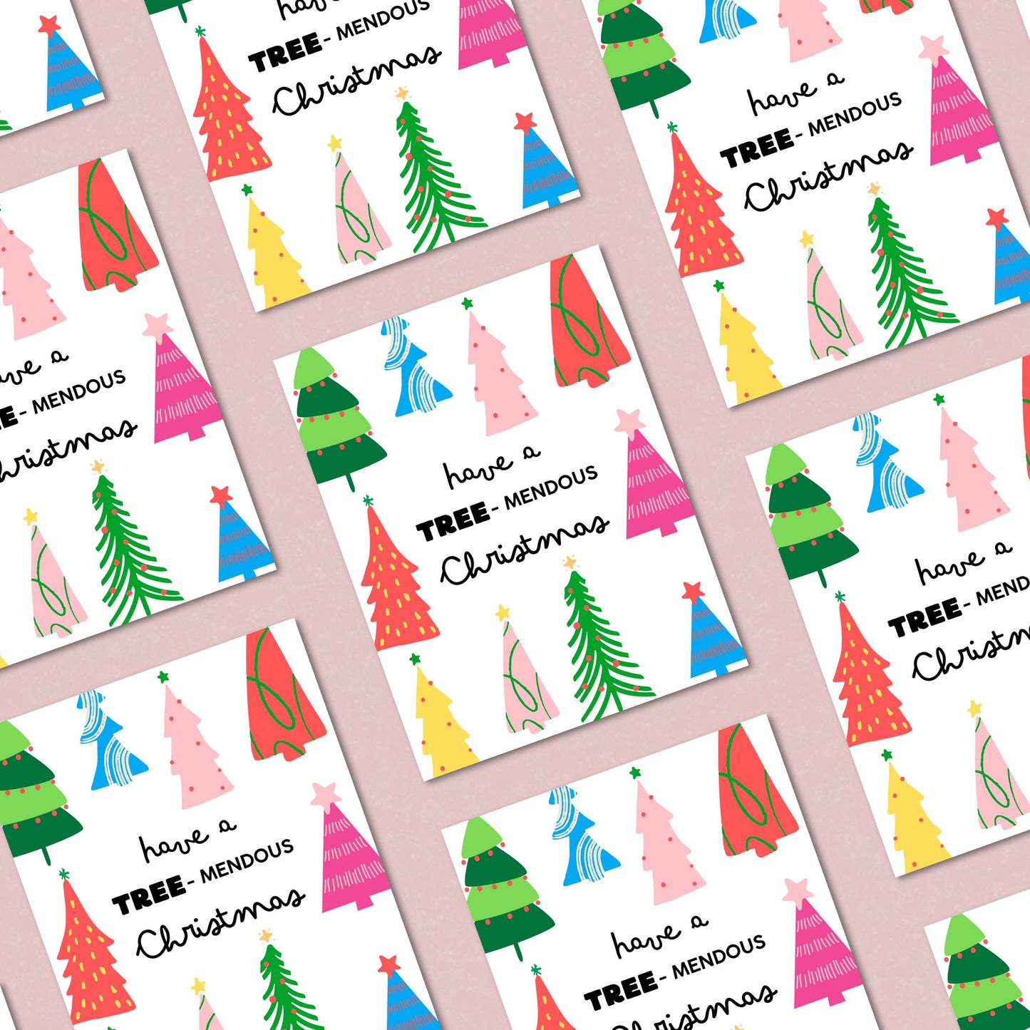 Have a Tree-mendous Christmas greeting card featuring a playful design of colorful Christmas trees and a festive phrase, perfect for spreading holiday cheer and sending fun, pun-filled holiday wishes to loved ones.