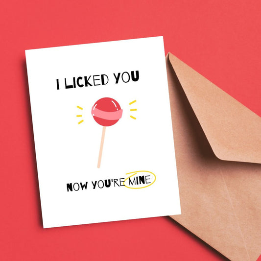 Greeting card with a red lollipop illustration and the funny phrase "I Licked You, Now You’re Mine." Perfect for expressing affection with humor.