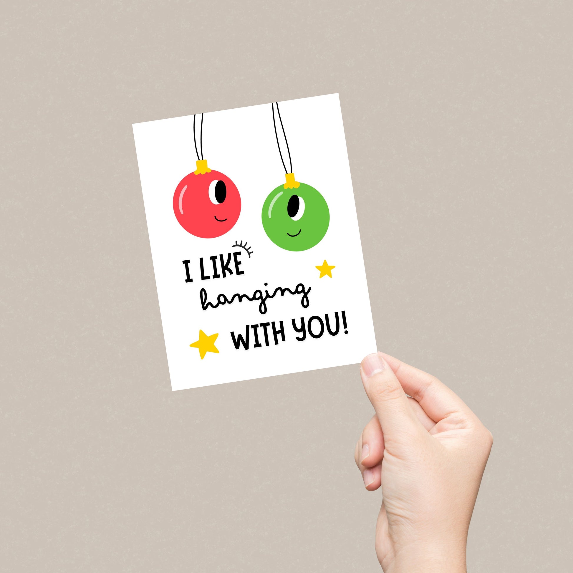 Christmas greeting card with two festive ornaments, one red and one green, and the playful phrase "I Like Hanging With You" in bold letters. Perfect for spreading holiday cheer, this funny card is ideal for friends, family, or loved ones.