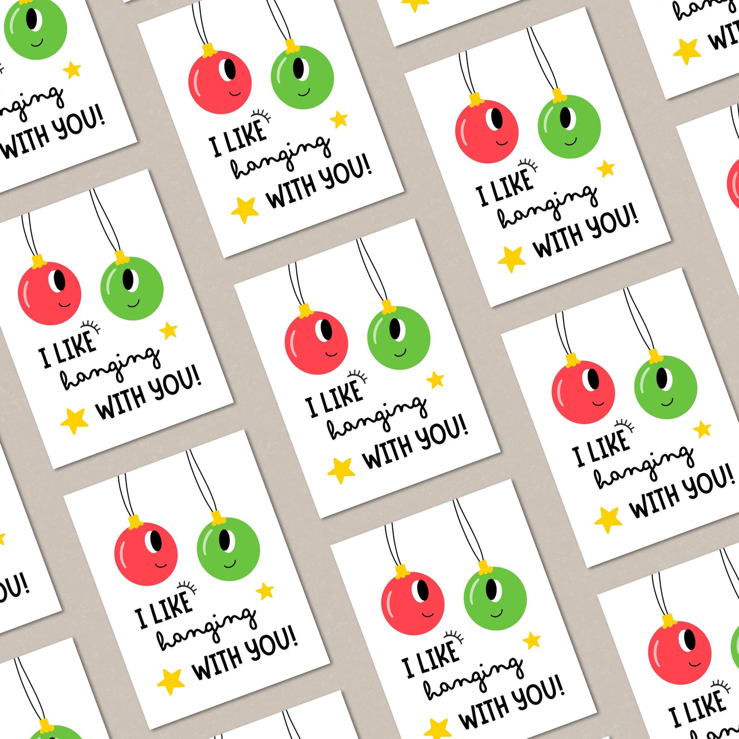 Christmas greeting card with two festive ornaments, one red and one green, and the playful phrase "I Like Hanging With You" in bold letters. Perfect for spreading holiday cheer, this funny card is ideal for friends, family, or loved ones.