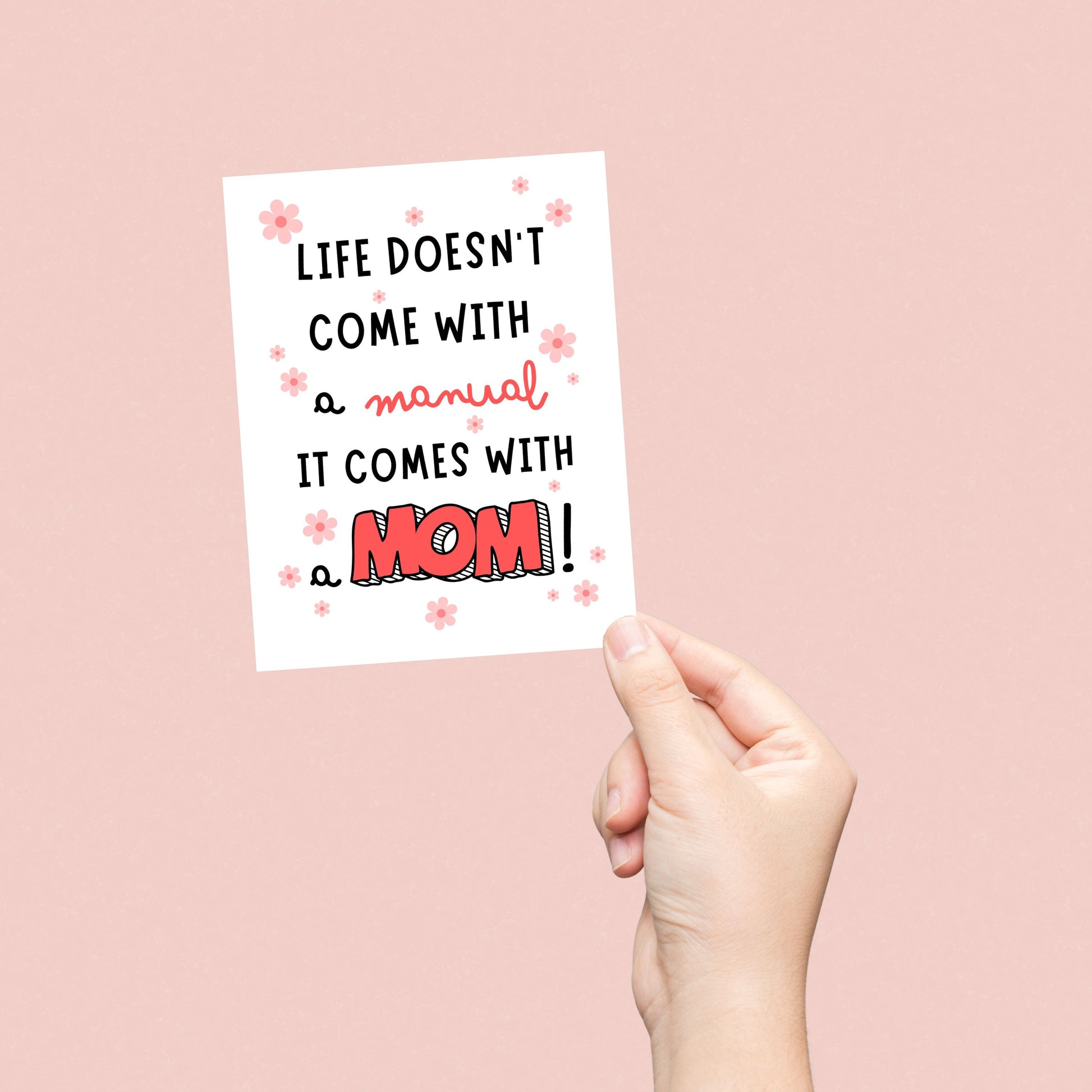 Mother's Day greeting card with colorful floral design and the phrase "Life Doesn't Come With A Manual It Comes With A Mom", perfect for funny and heartfelt messages for moms. Great card for Mother's Day or mom's birthday.