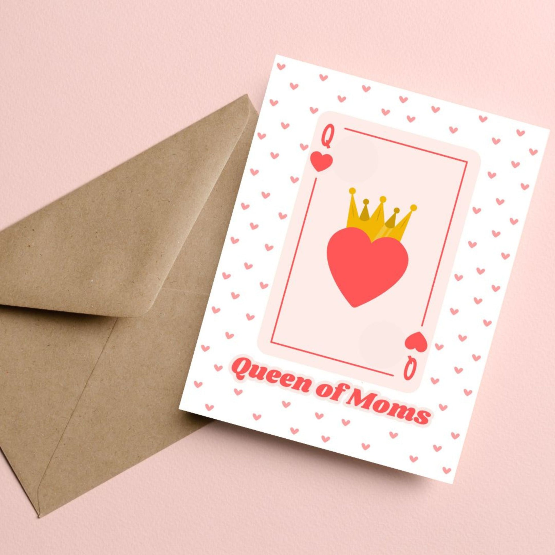 Queen of Moms greeting card featuring a Queen of Hearts playing card design with a crowned heart in the center and a background filled with small red hearts. Perfect for Mother's Day, birthdays, or just because.