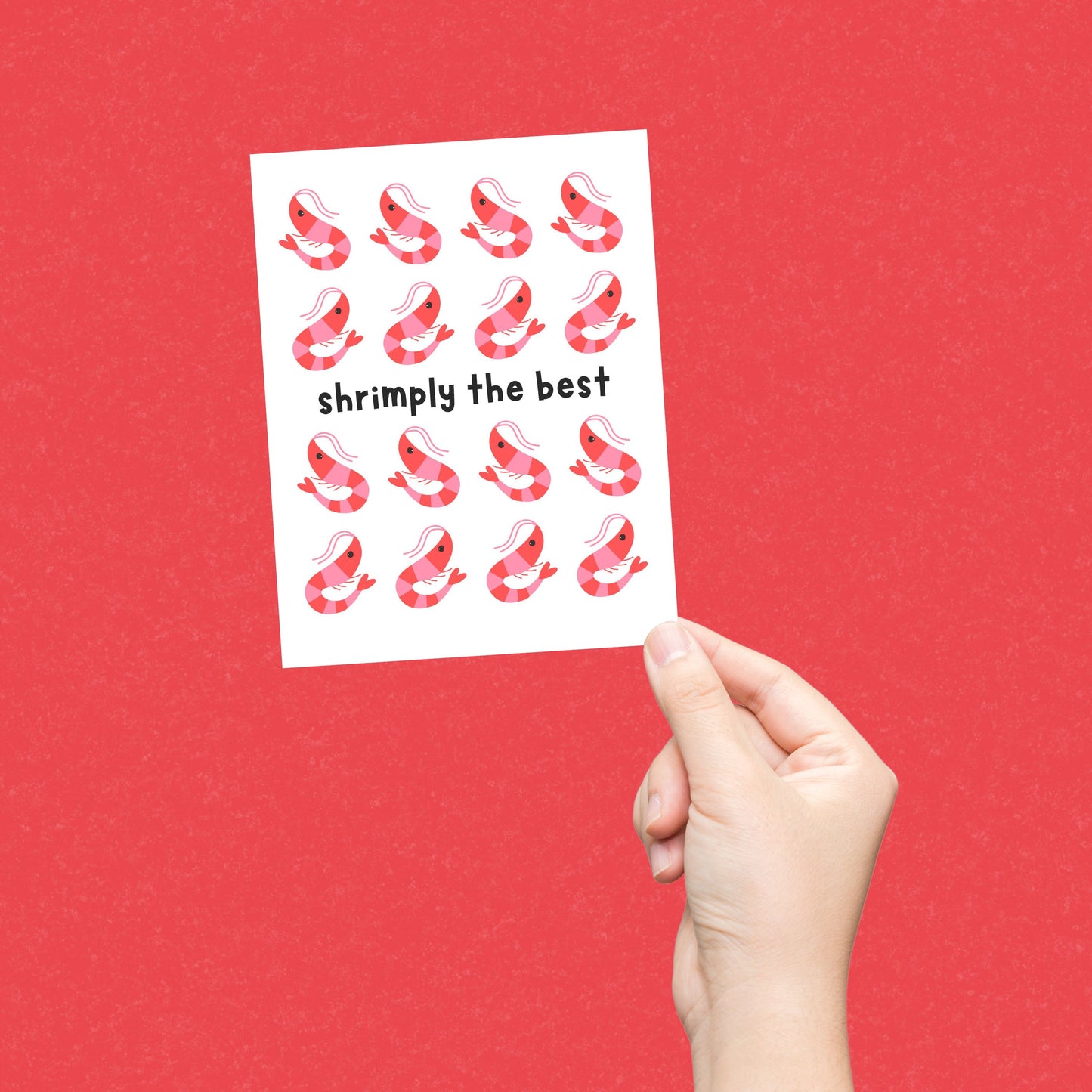 Cute greeting card featuring multiple cartoon shrimp illustrations with the playful phrase Shrimply the Best, perfect for thank you notes, encouragement, or celebrating someone special, printed on premium cardstock