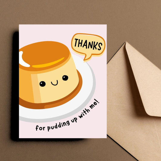 Cute thank you greeting card with a smiling pudding illustration and the phrase "Thanks For Pudding Up With Me". Perfect pun card for friends, family, or coworkers to show appreciation, humor, and gratitude.