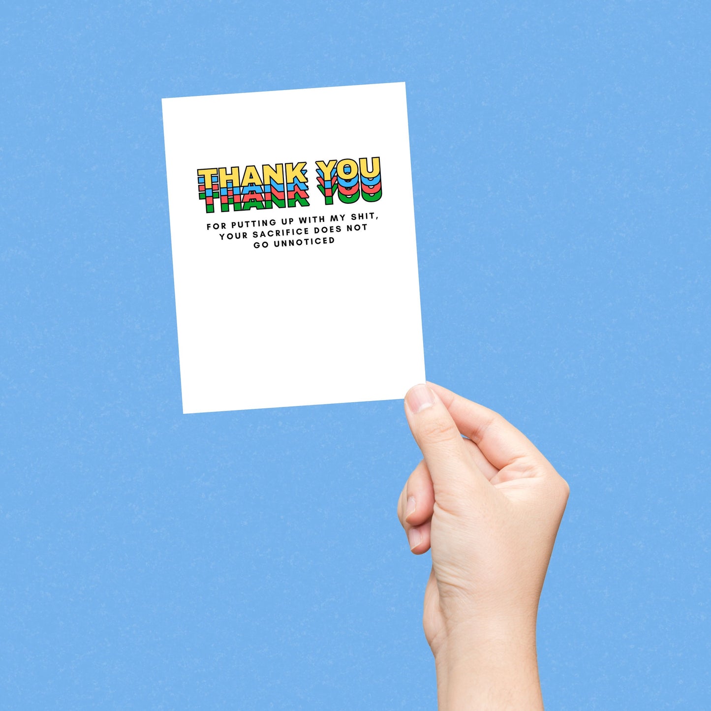 Greeting card with colorful block letters spelling Thank You and smaller text reading for putting up with my shit your sacrifice does not go unnoticed. Perfect for expressing gratitude with humor and a personal touch.