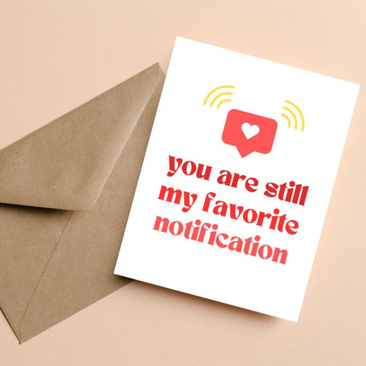 Funny romantic greeting card with a red notification icon and heart, featuring the phrase "You Are Still My Favorite Notification", perfect for anniversaries, Valentine's Day, or to surprise your partner with a tech-savvy love message.