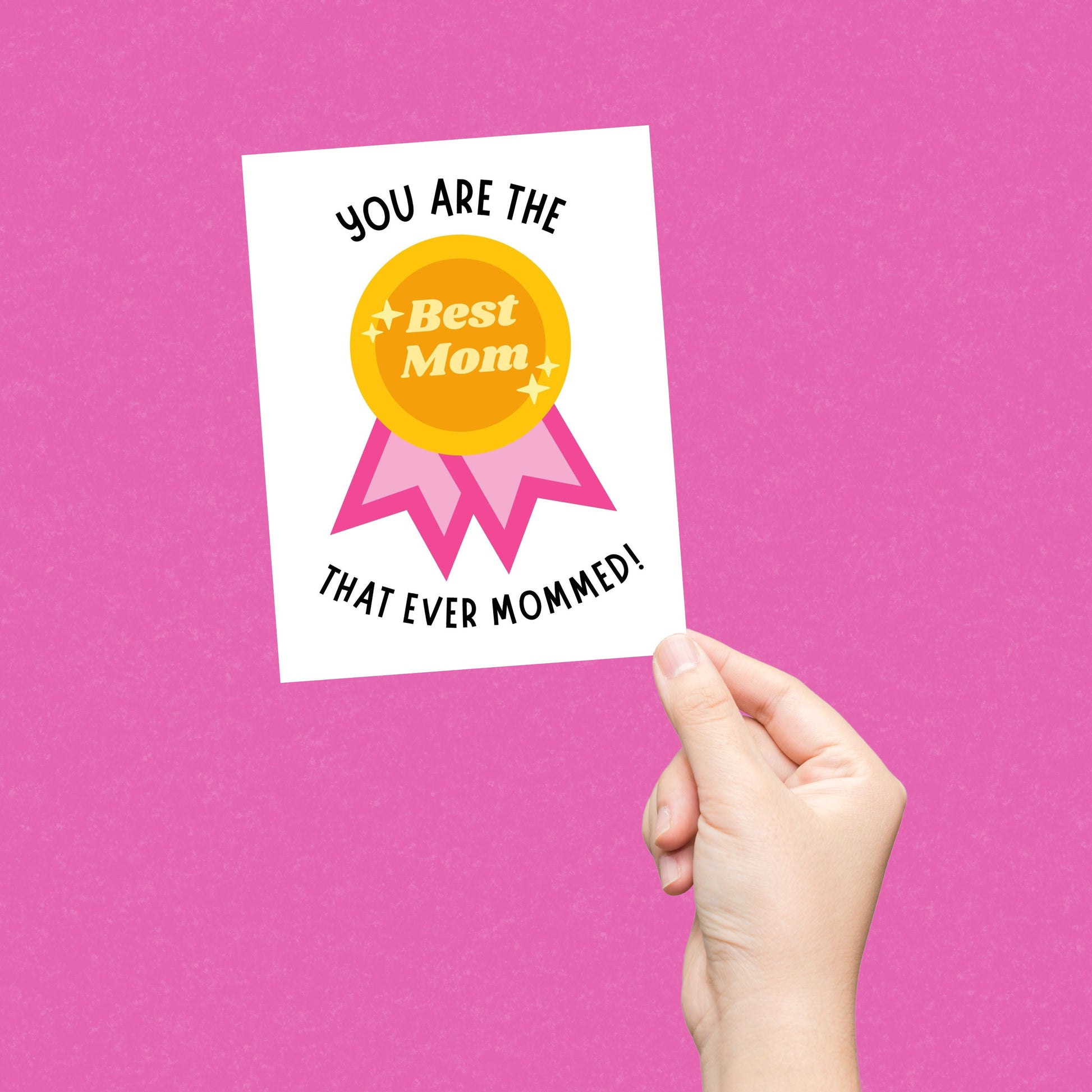 Funny Mother's Day card with a winner badge that says "Best Mom" and the phrase "You Are The Best Mom That Ever Mommed." Perfect for celebrating moms with humor and appreciation. Great for Mother’s Day, birthdays, or just because!