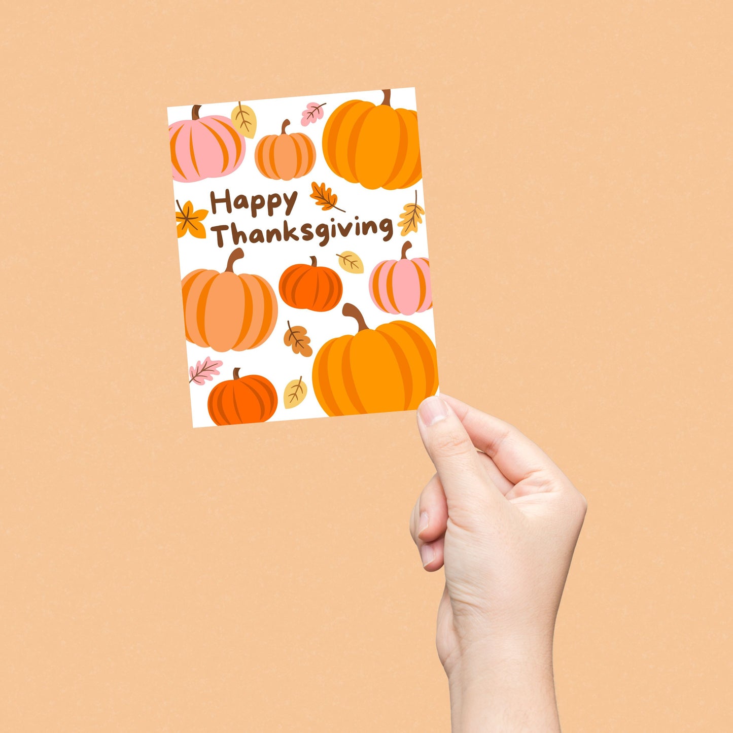 Thanksgiving greeting card with pumpkins and autumn leaves, featuring the phrase 'Happy Thanksgiving'. Festive fall-themed card perfect for expressing gratitude and sending holiday cheer.
