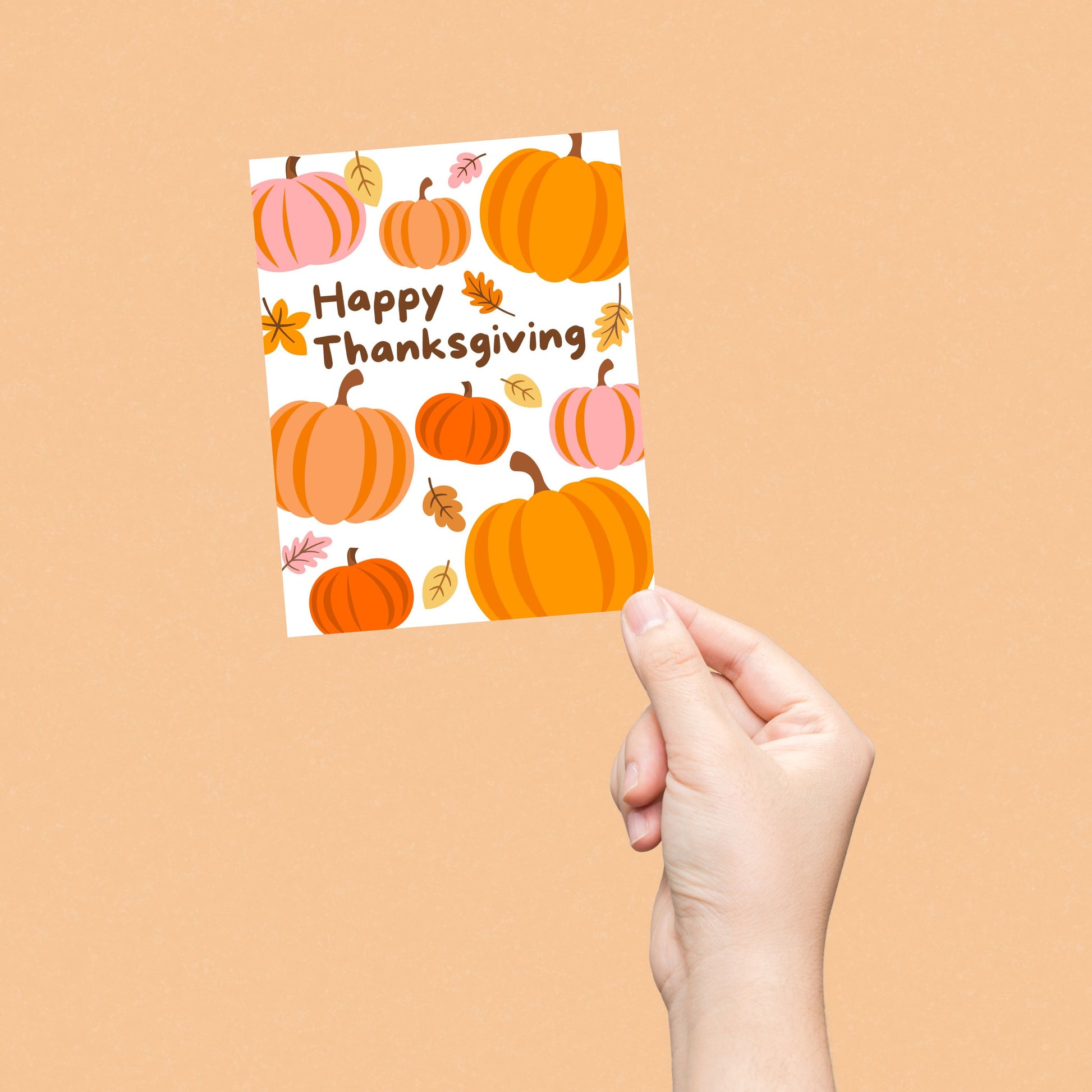 Thanksgiving greeting card with pumpkins and autumn leaves, featuring the phrase 'Happy Thanksgiving'. Festive fall-themed card perfect for expressing gratitude and sending holiday cheer.