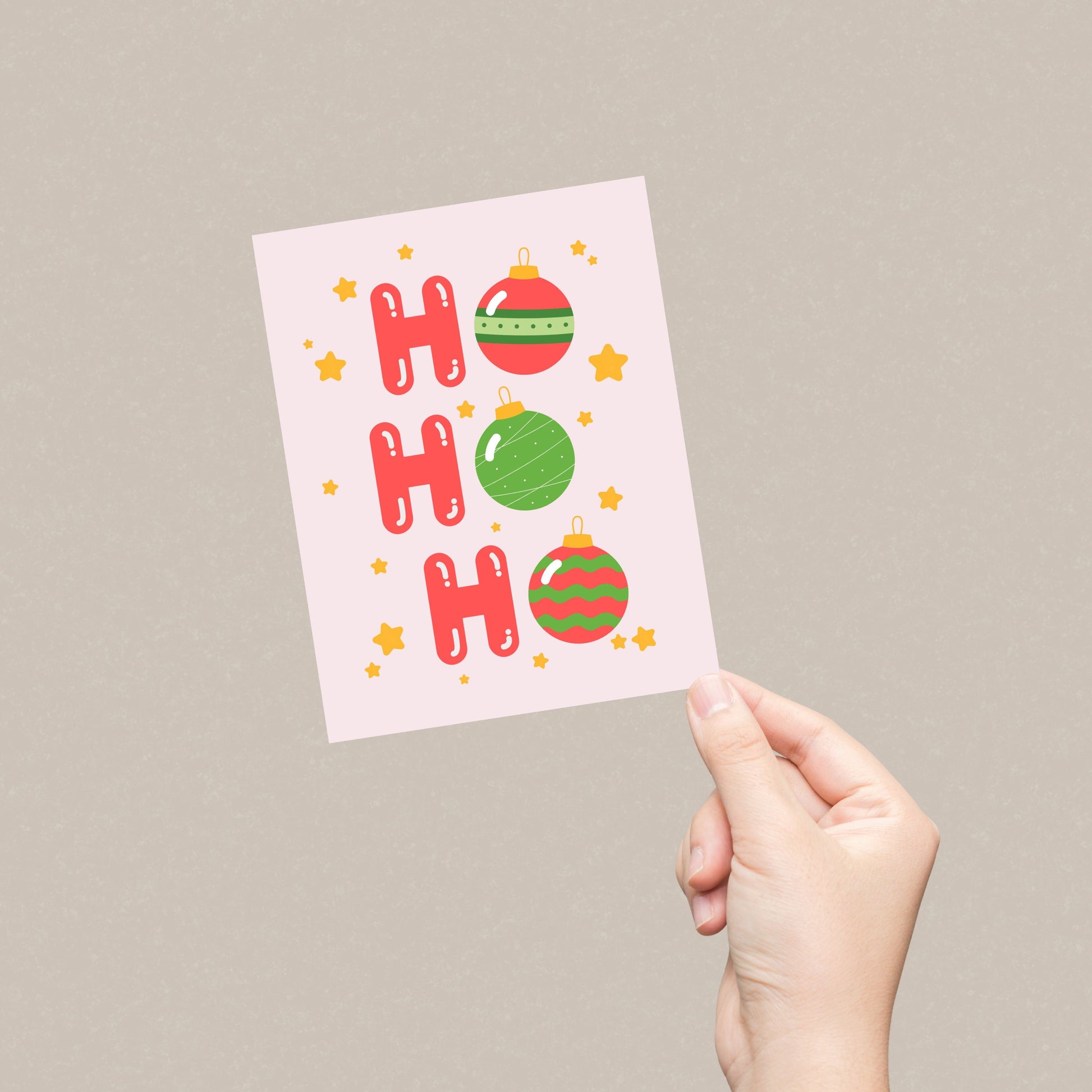 Christmas greeting card with the words 'Ho Ho Ho' featuring festive tree ornaments as the 'O's. The card has a playful holiday design perfect for spreading Christmas cheer. Ideal for sending warm wishes during the holiday season.