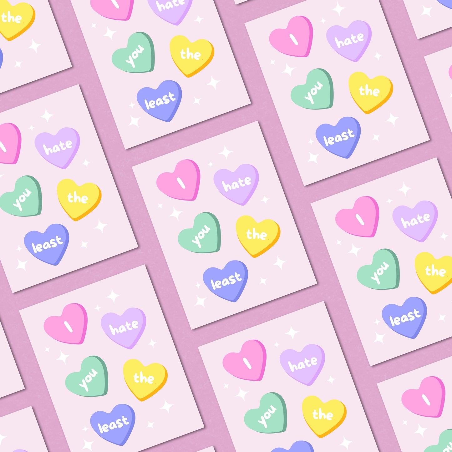 Funny greeting card with conversation heart candies, each displaying a word from the phrase 'I Hate You The Least.' Playful and humorous design perfect for Valentine's Day, friendships, or lighthearted occasions.
