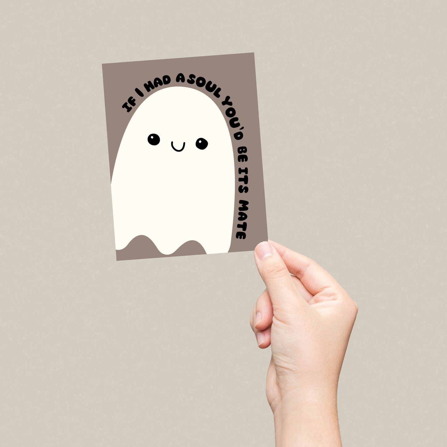 Cute Halloween greeting card featuring a playful ghost illustration with the phrase 'If I Had A Soul You'd Be Its Mate.' Perfect for sending a spooky and fun message to someone special. Ideal for Halloween or soulmate-themed greetings.