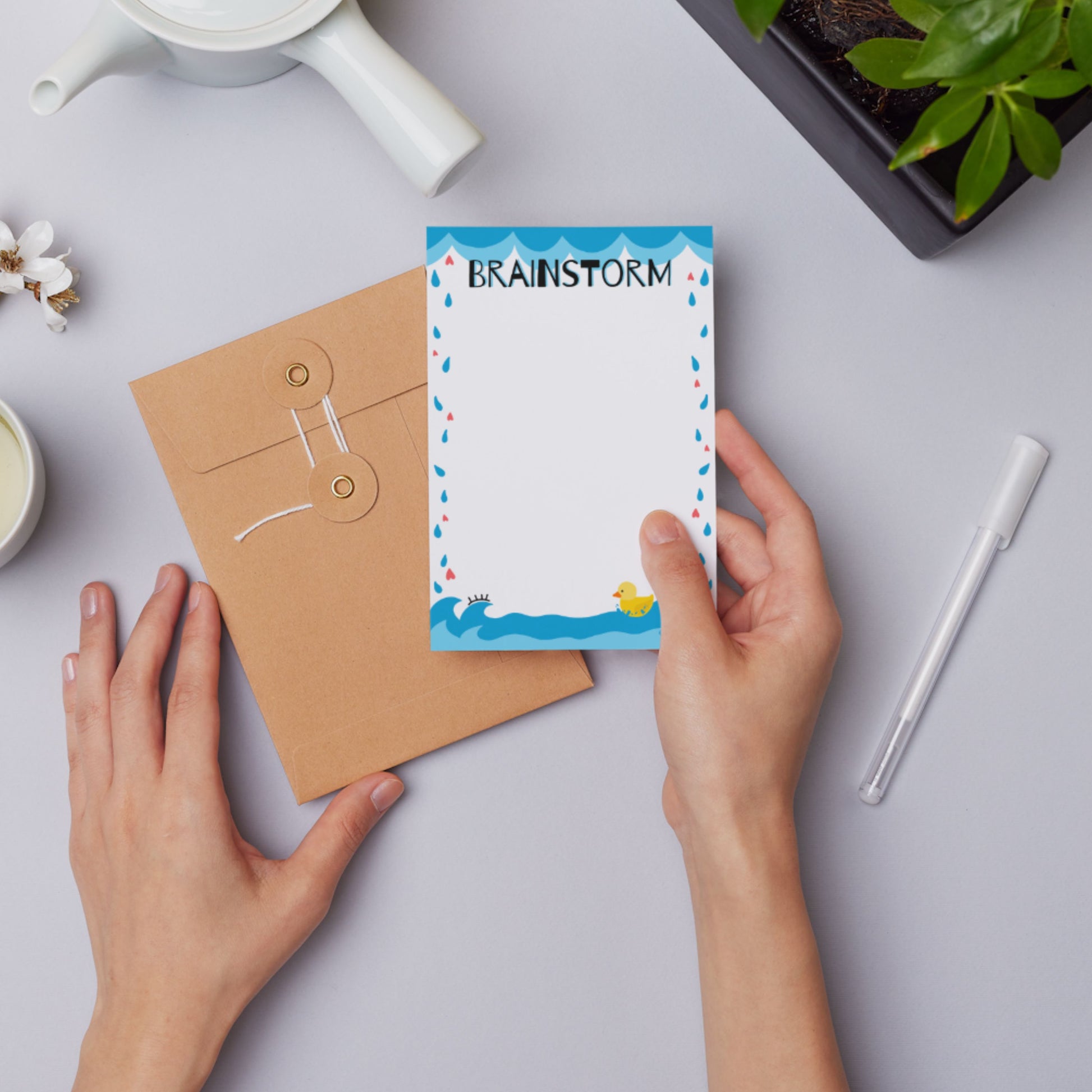 Brainstorm Notepad with heart-shaped rain, ocean bottom, and yellow rubber duck illustration, perfect for capturing ideas, doodling, and creative notes.