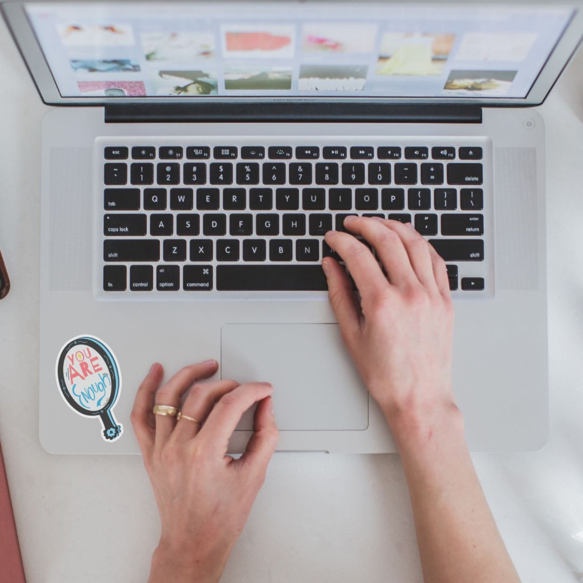 Sticker with the phrase You Are Enough inside an original design of a handheld mirror on a white background. Encouraging and uplifting message, perfect for laptops, journals, or phone cases. Great for promoting self-love and positivity.