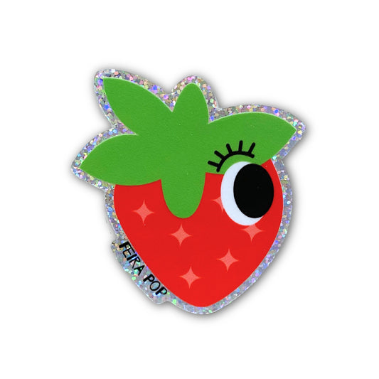 Glitter sticker with a cute strawberry drawing featuring one big eye, perfect for adding a playful and sparkly touch to your belongings.