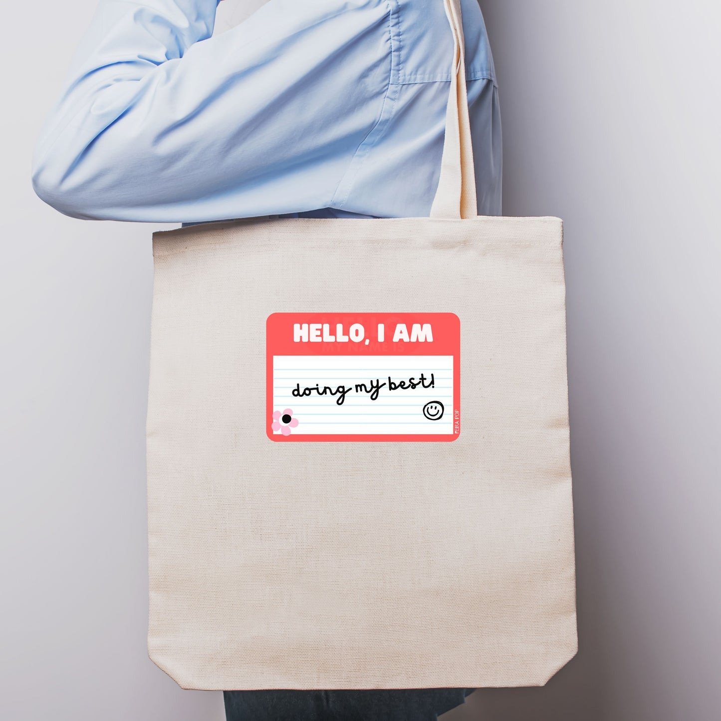 Tote bag with a drawing of a red name tag that reads Hello, I am Doing My Best – perfect for adding a touch of humor and positivity to your day.