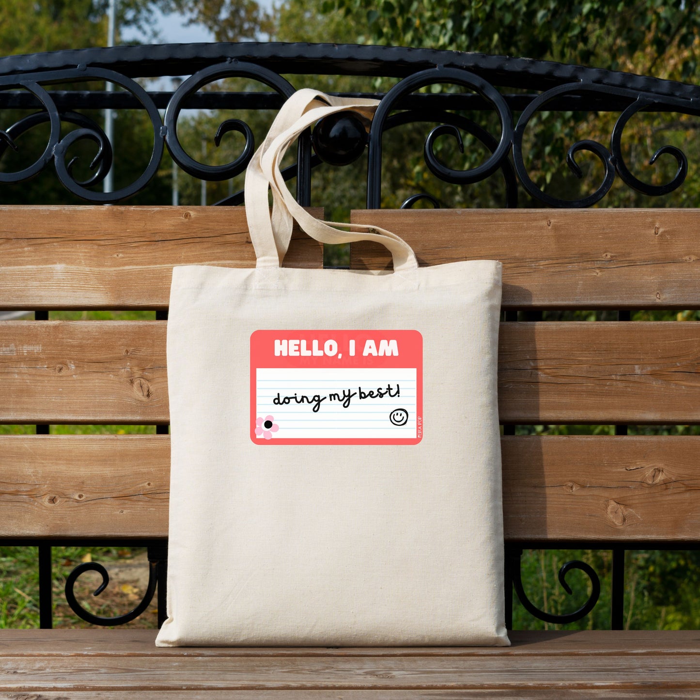 Tote bag with a drawing of a red name tag that reads Hello, I am Doing My Best – perfect for adding a touch of humor and positivity to your day.