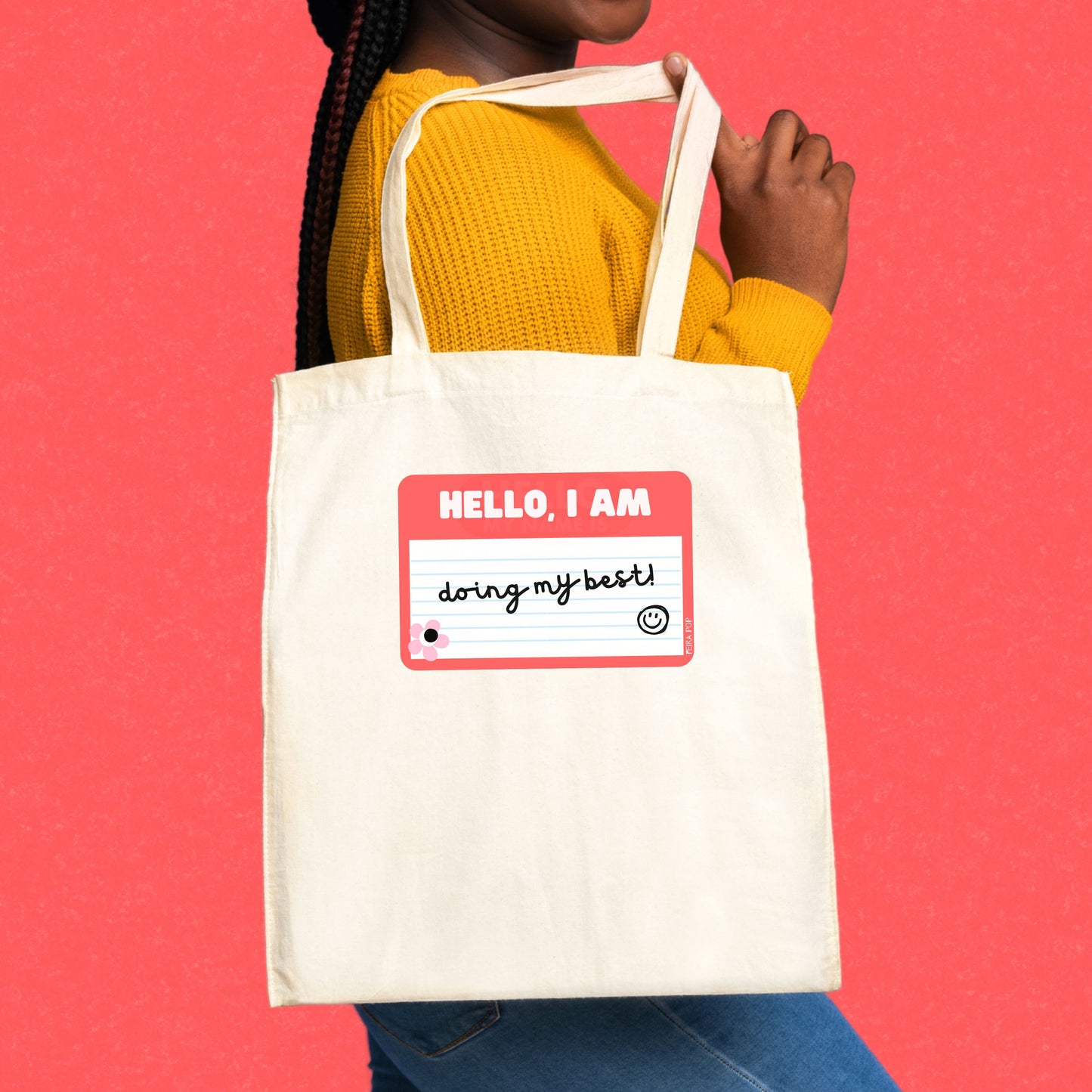 Tote bag with a drawing of a red name tag that reads Hello, I am Doing My Best – perfect for adding a touch of humor and positivity to your day.