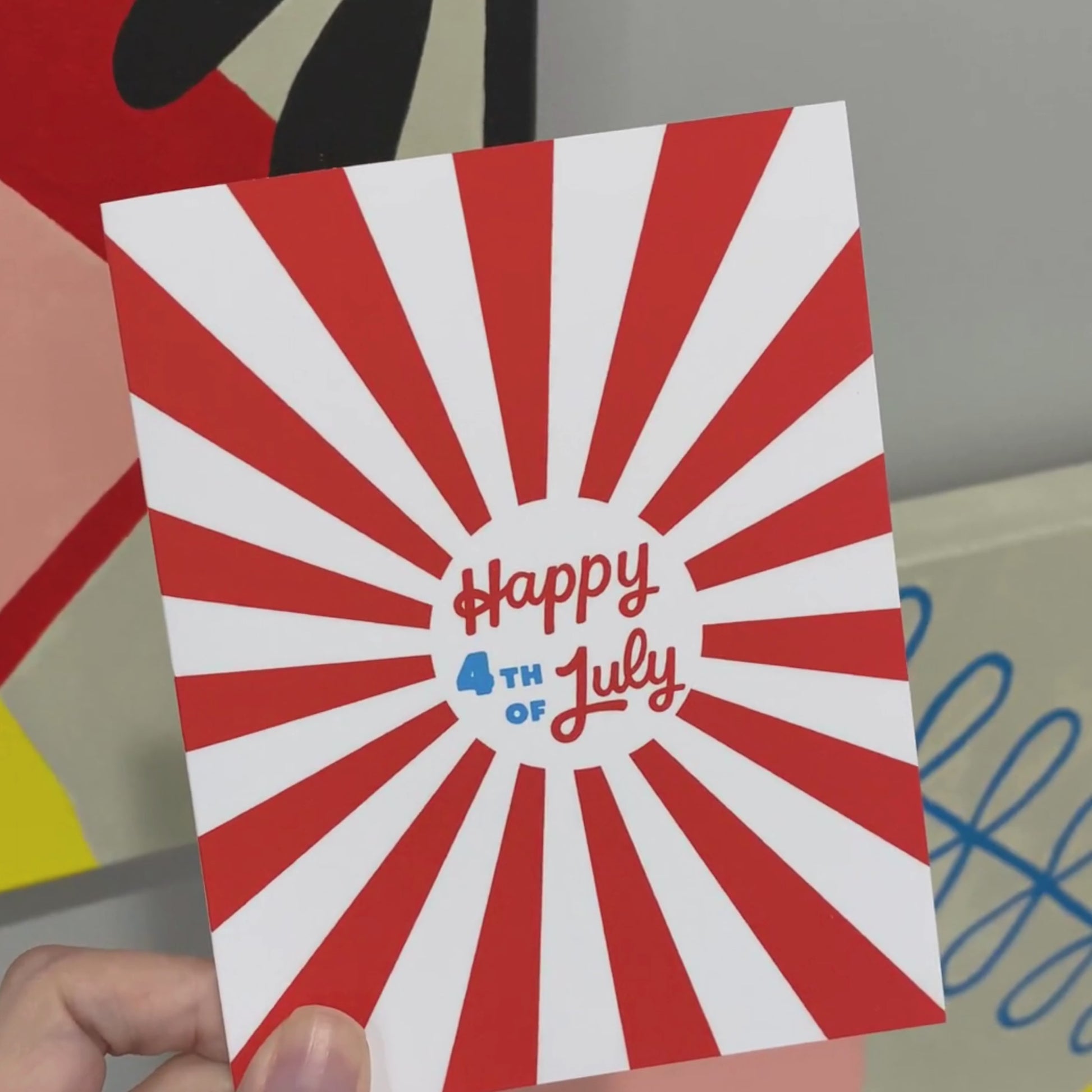 Greeting card with the phrase Happy 4th of July written in bold blue and red letters, featuring red rays in the background. Perfect for adding a patriotic touch to Independence Day celebrations.