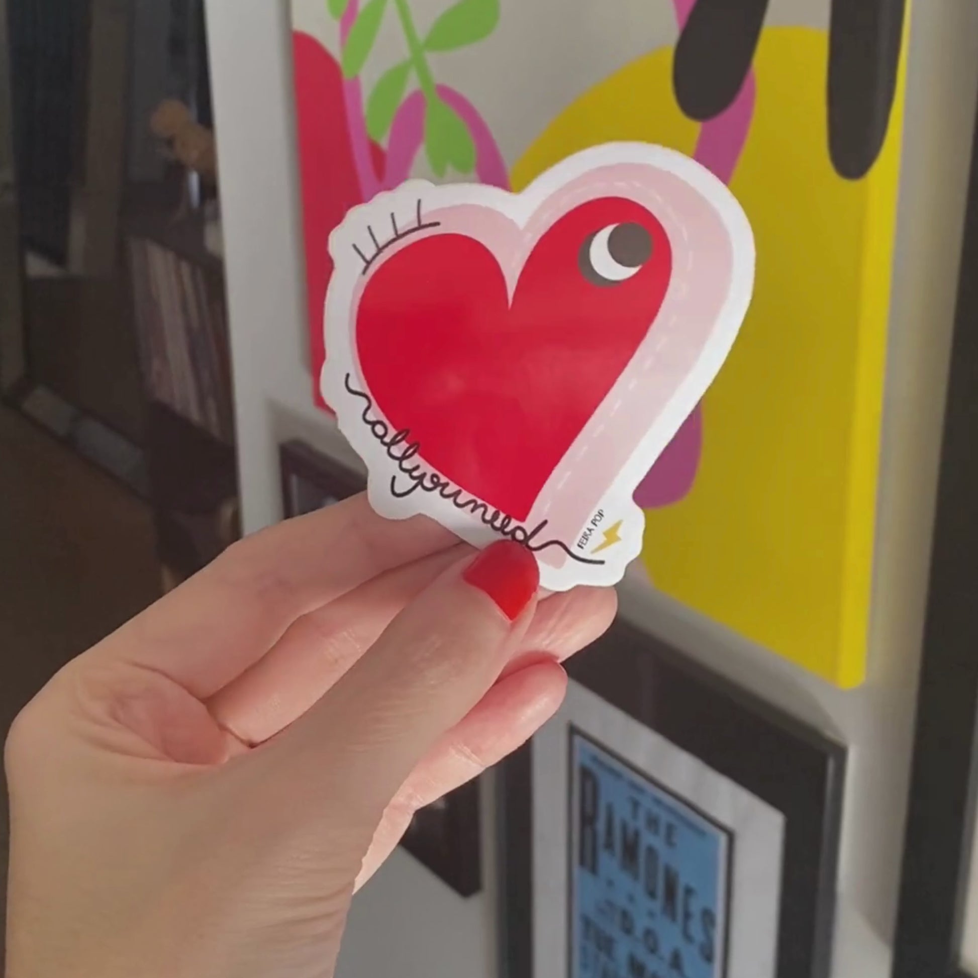 Sticker with the phrase 'All You Need' featuring a drawing of a big red heart with one eye. Perfect for laptops, notebooks, and water bottles, this quirky design adds a touch of whimsy and spreads love and good vibes.