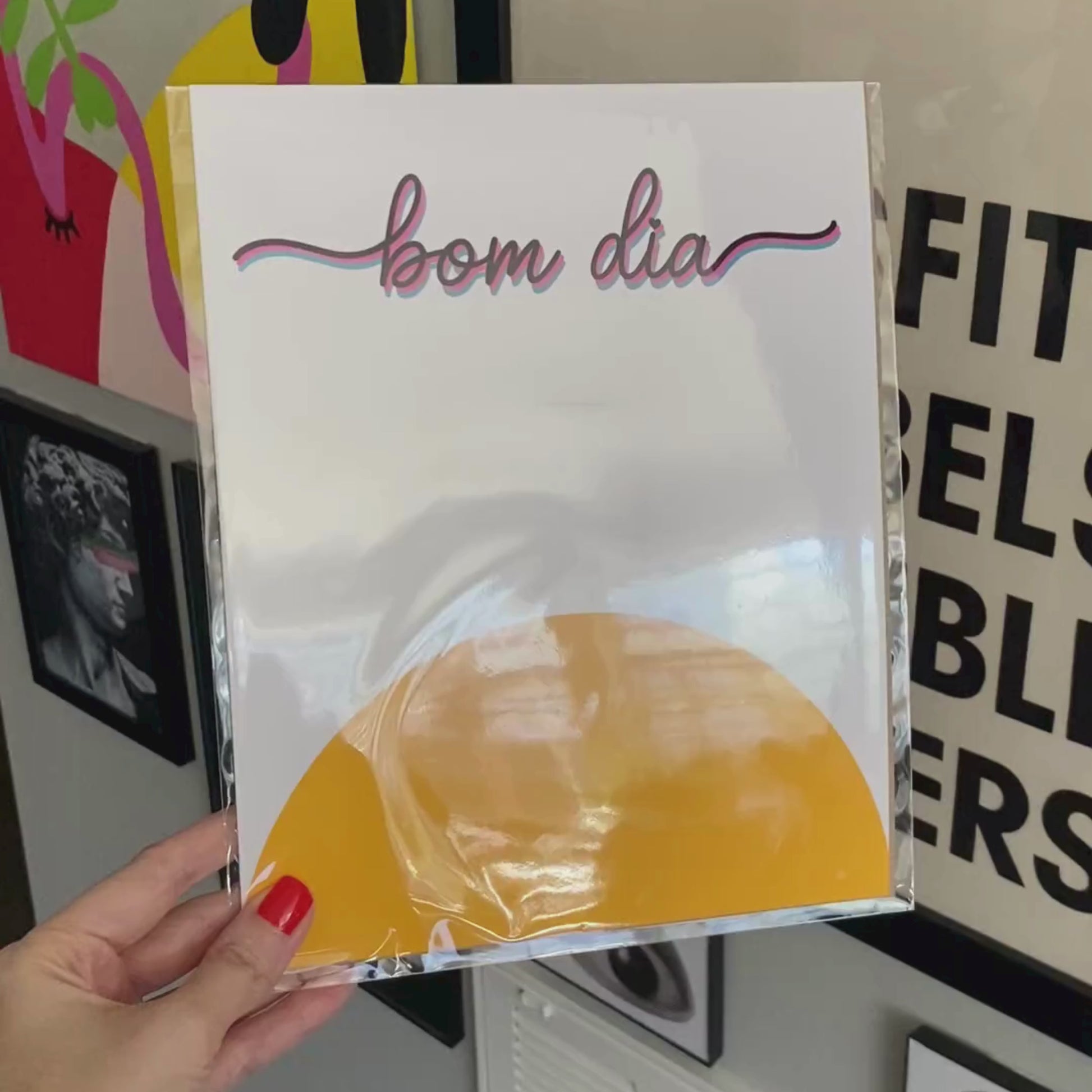 Bom Dia Art Print featuring a vibrant yellow sun and the spirited phrase Bom Dia, perfect for brightening any space with a cheerful morning greeting. Bom Dia means Good Morning in Portuguese.