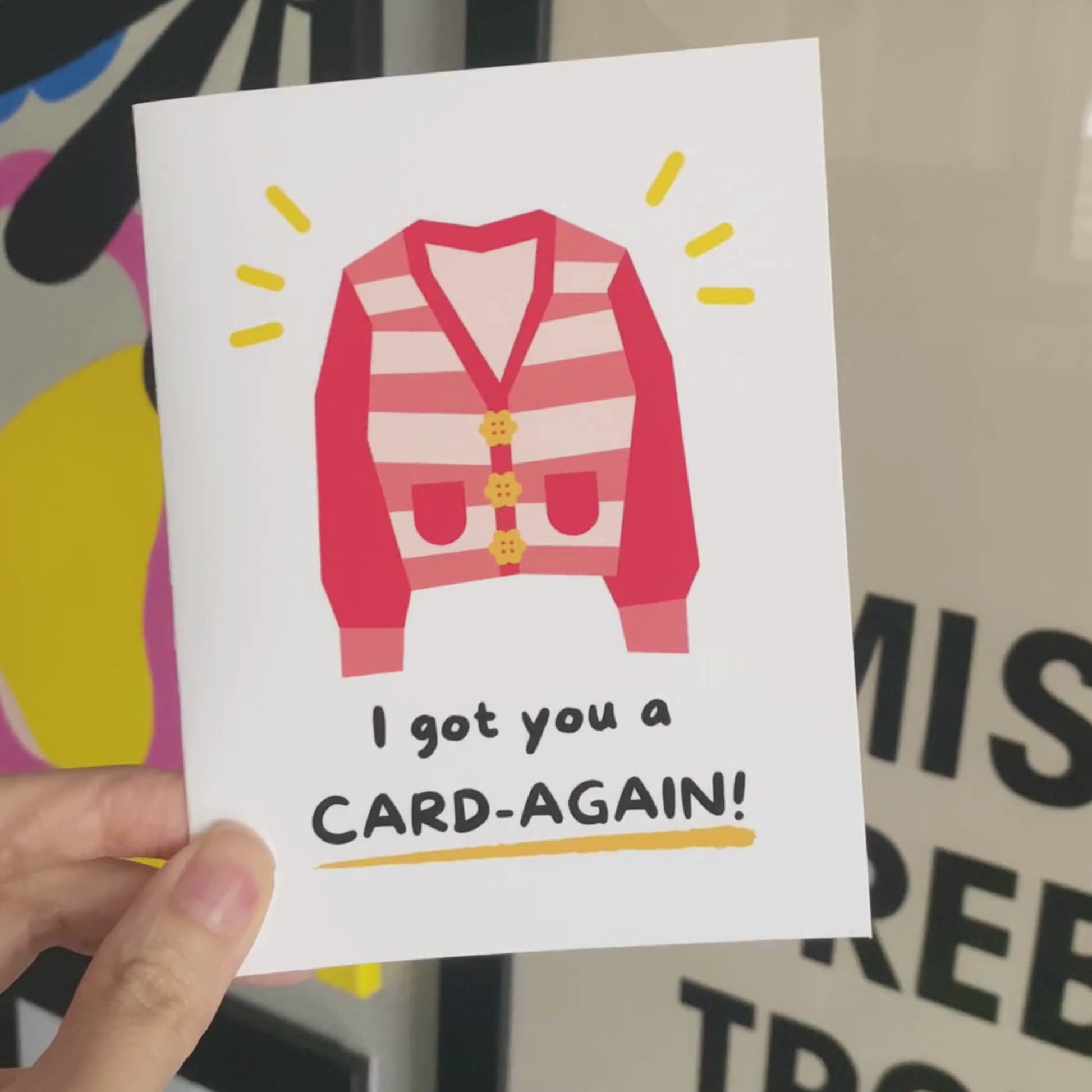 Cute greeting card featuring an illustration of a cozy cardigan with the punny phrase I Got You A Card-Again. Perfect for birthdays, just-because moments, or to bring a smile with a clever play on words.