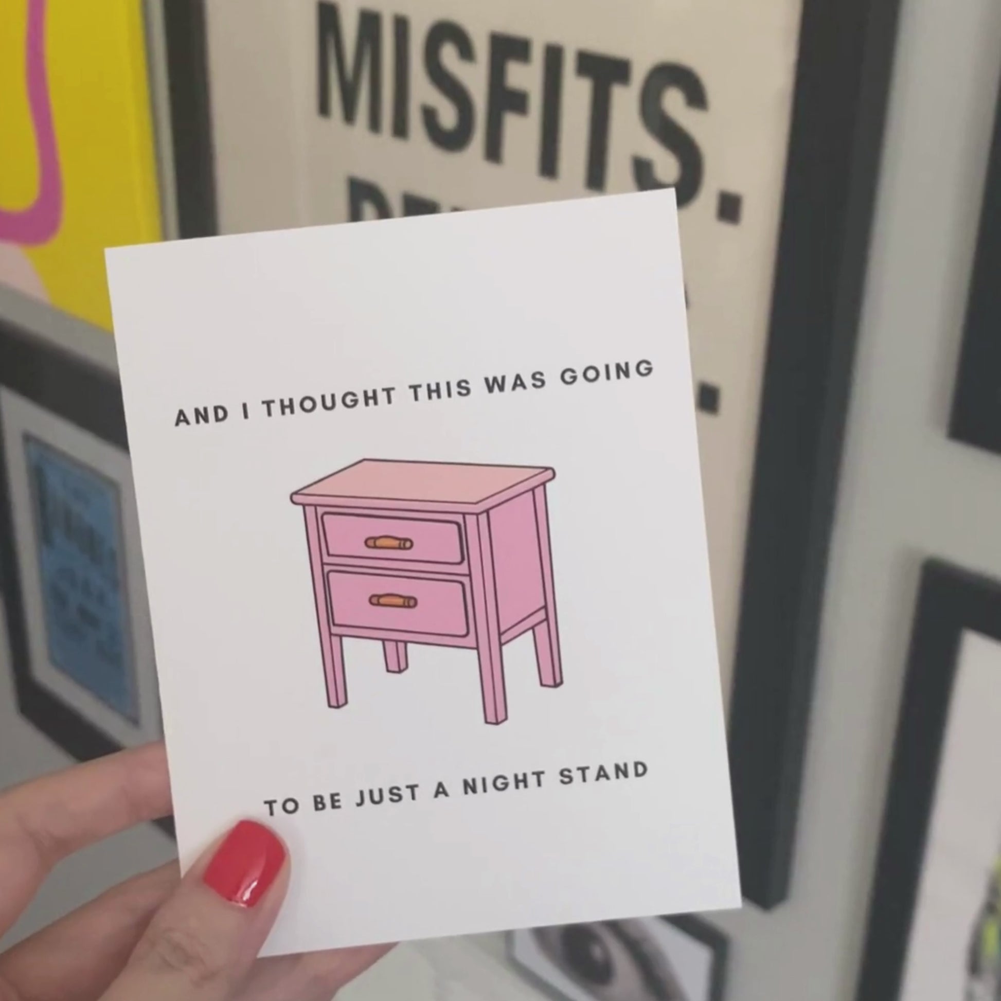 Greeting card with the phrase And I Thought This Was Going to Be a Night Stand featuring an illustration of a pink nightstand with two drawers. Perfect for celebrating relationships with a humorous and cheeky touch.