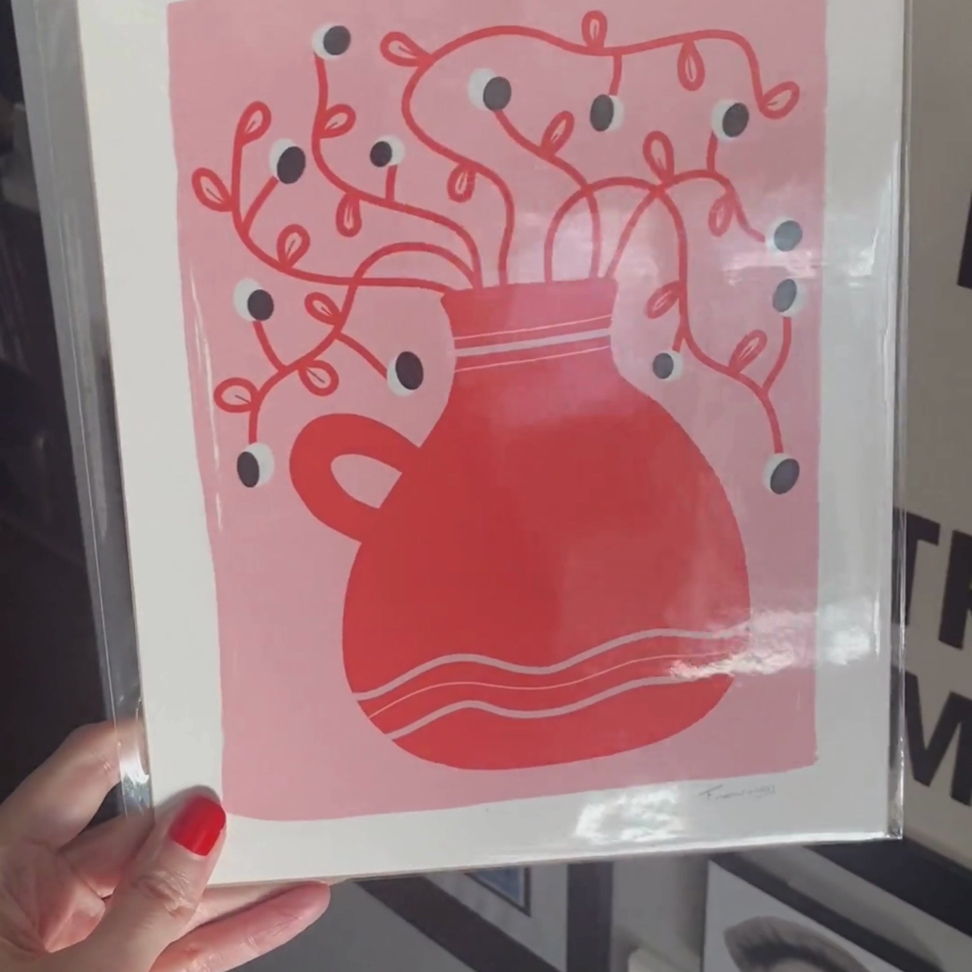 Look At Nature art print with a whimsical drawing of a red vase and a crazy plant with tiny eyes against a pink background, adding playful charm to any room.