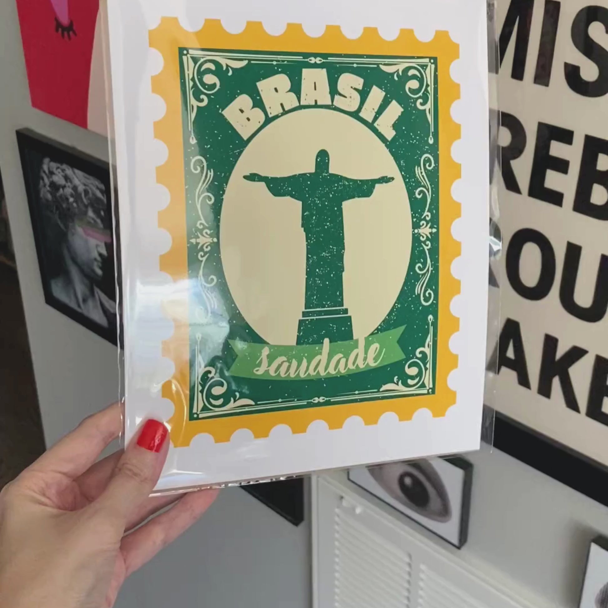 Saudade Art Print featuring a yellow and green vintage-style stamp with Cristo Redentor in the center, perfect for adding a touch of Brazilian charm to your space.