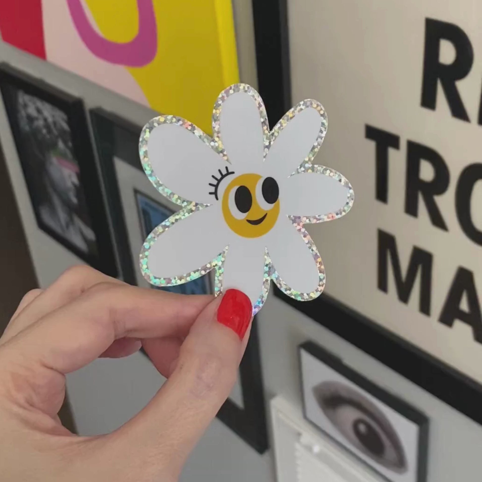 Glitter white daisy sticker with a smiley face, perfect for adding a touch of whimsy and positivity to your belongings.