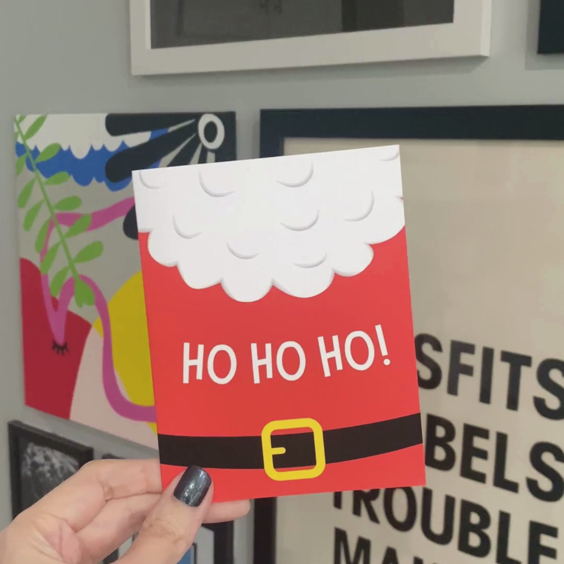 Close-up of Santa's red suit featuring his white fluffy beard and black belt with the phrase "Ho Ho Ho," festive Christmas greeting card for spreading holiday cheer, funny holiday card design perfect for Christmas gifts or heartfelt messages.