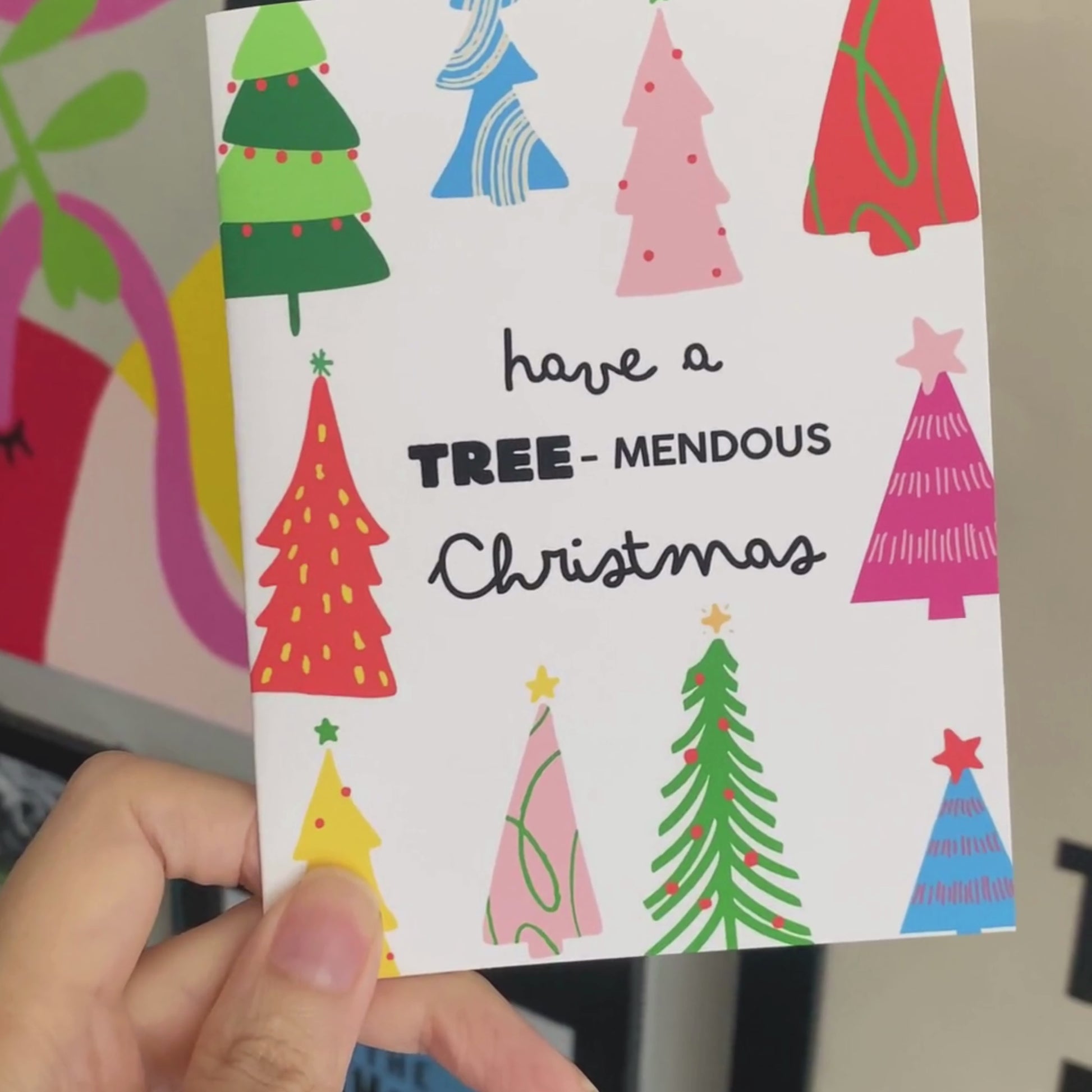 Have a Tree-mendous Christmas greeting card featuring a playful design of colorful Christmas trees and a festive phrase, perfect for spreading holiday cheer and sending fun, pun-filled holiday wishes to loved ones.