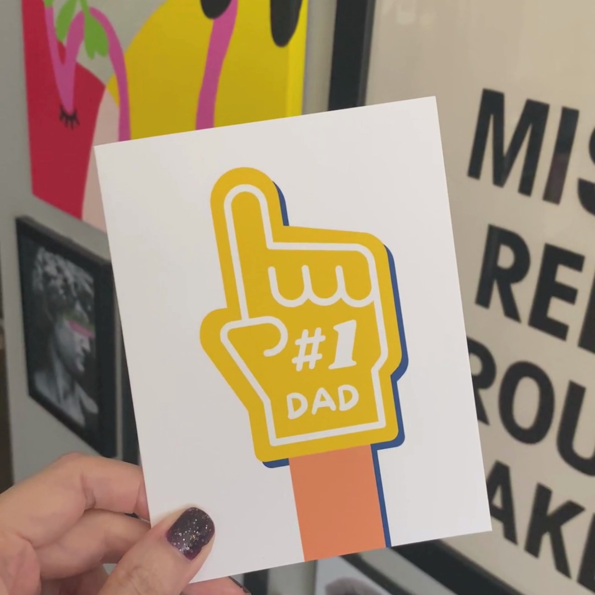 Greeting card with the phrase Number 1 Dad and a drawing of a yellow foam hand. Perfect for celebrating Father's Day or a birthday with humor and charm, showing your dad he's the best.