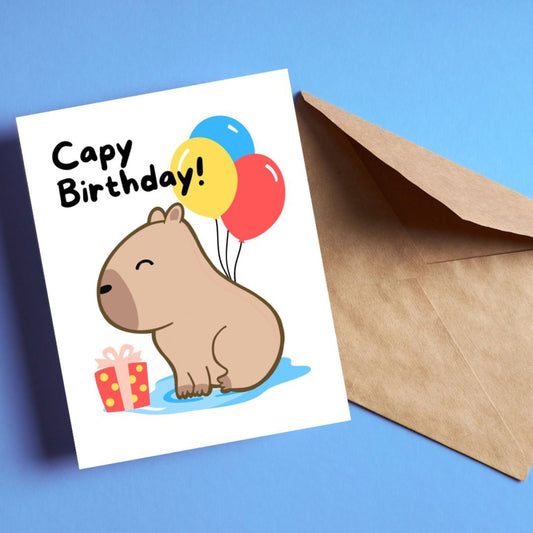 Capybara birthday card with colorful balloons, gift, and the phrase 'Capy Birthday.' Perfect for capybara lovers and playful birthday celebrations. Cute animal-themed greeting card for spreading birthday cheer.