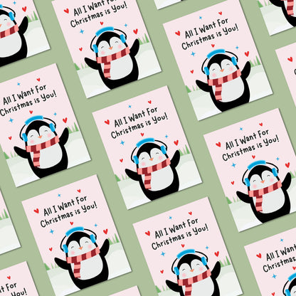 Cute Christmas card featuring an adorable penguin standing in a snowy winter scene with the phrase “All I Want For Christmas Is You.” Festive holiday card perfect for couples, romantic Christmas greetings, and seasonal gifting.