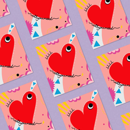 Greeting card with the phrase All you Need featuring a drawing of a big red heart with one eye and a colorful background. Perfect for celebrating any occasion with a playful and heartfelt touch.