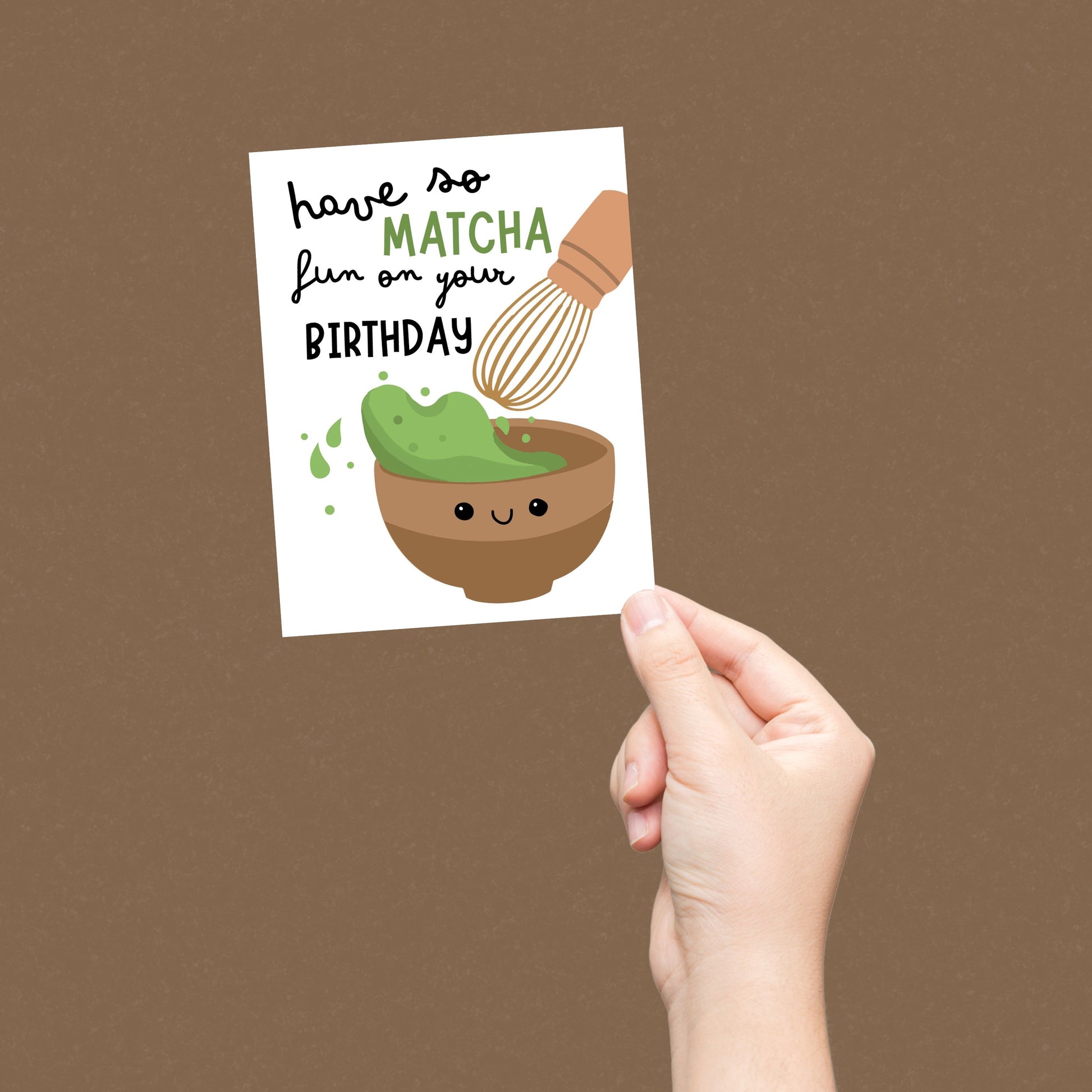 Cute birthday greeting card featuring a smiley matcha drink and the phrase Have So Matcha Fun On Your Birthday, perfect for tea lovers and pun enthusiasts.