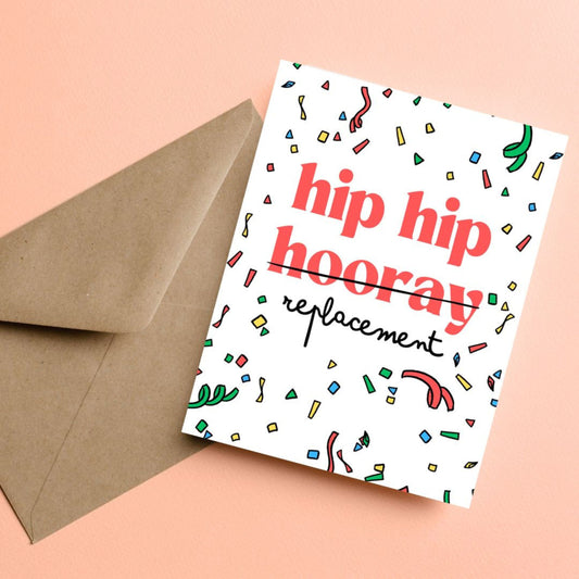 Birthday greeting card with the phrase Hip Hip Hooray Replacement on a confetti-filled background, with "hooray" crossed out and replaced with "replacement." Perfect for celebrating birthdays with a great laugh.