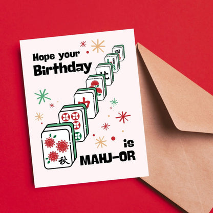 Funny mahjong birthday greeting card featuring colorful mahjong tiles and the phrase “Hope Your Birthday Is Mahj-or,” a playful pun card perfect for mahjong lovers, game night fans, and unique birthday celebrations.