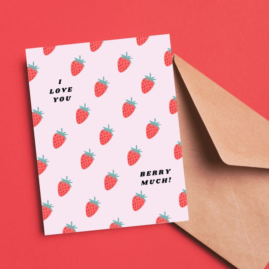 Greeting card with the phrase I Love You Berry Much on a pink background filled with little strawberries. Perfect for expressing love and appreciation with humor and charm.