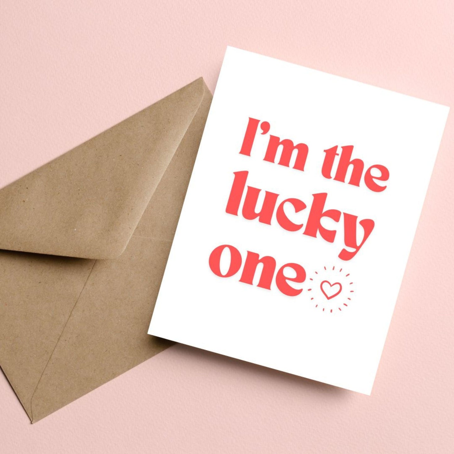 Greeting card with bold red letters and the phrase "I'm The Lucky One" with a small heart, perfect for anniversaries, Valentine's Day, or expressing love and appreciation.