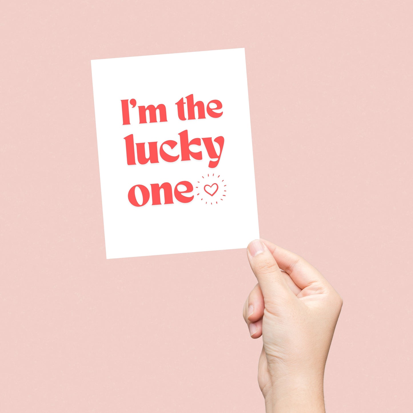 Greeting card with bold red letters and the phrase "I'm The Lucky One" with a small heart, perfect for anniversaries, Valentine's Day, or expressing love and appreciation.